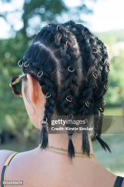 Model and Actress Betty Bachz, hair detail, during Wilderness Festival 2018 at Cornbury Park on August 4, 2018 in Oxford, England.
