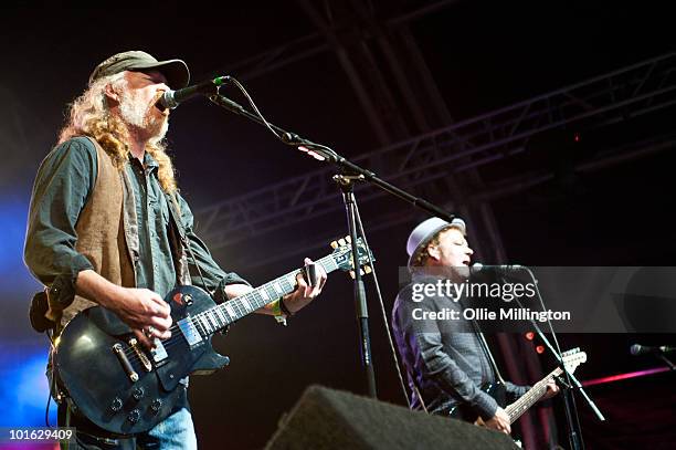 Matt Savage and Mark Chadwick of The Levellers performing on stage on the first day of Wychwood Festival at Cheltenham Racecourse on June 4, 2010 in...