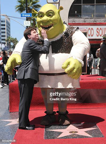 Actor Mike Myers poses with "Shrek" at the Hollywood Walk Of Fame star ceremony honoring "Shrek" held on May 20, 2010 in Hollywood, California.