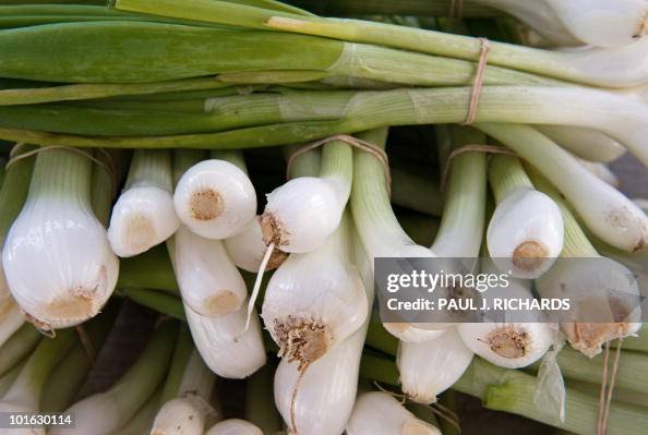 Spring onions are seen for sale at a 