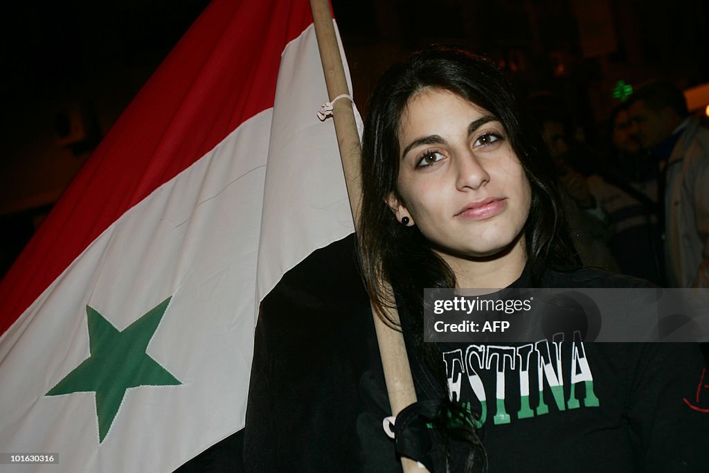 Activists hold Palestinian flags during