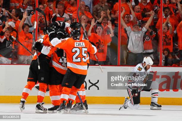 Ville Leino of the Philadelphia Flyers celebrates with teammates after scoring a goal in the third period against the Chicago Blackhawks in Game Four...