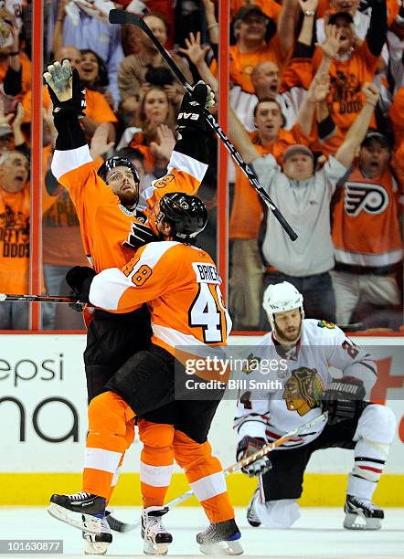 Ville Leino and Daniel Briere of the Philadelphia Flyers celebrate the fourth Flyers goal scored by Leino in the third period of Game Four of the...