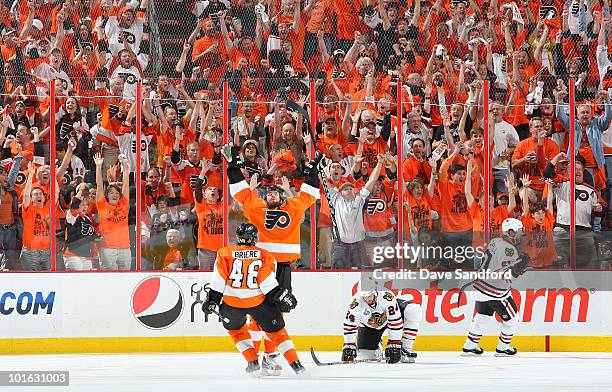 Ville Leino and Daniel Briere of the Philadelphia Flyers celebrate the fourth Flyers goal scored by Leino in the third period of Game Four of the...