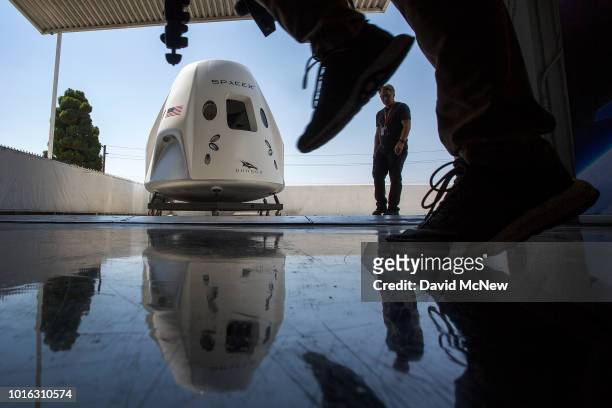 Mock up of the Crew Dragon spacecraft is seen during a media tour of SpaceX headquarters and rocket factory on August 13, 2018 in Hawthorne,...