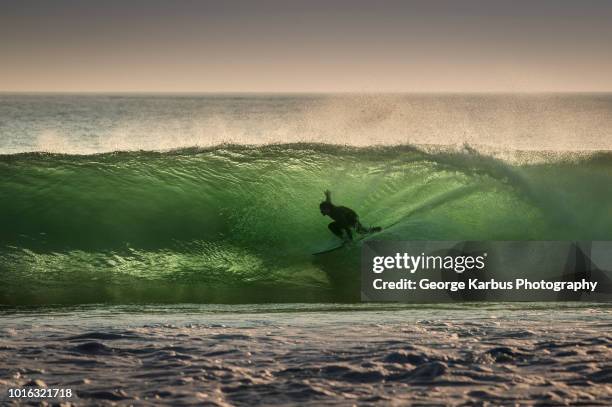 surfer surfing on barreling wave, crab island, doolin, clare, ireland - ireland surf wave ストックフォトと画像