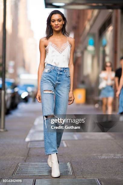 Lameka Fox is seen wearing an Iro top, Reformation jeans, Phillip Lim shoes with Celina sunglasses in Chelsea on August 13, 2018 in New York City.