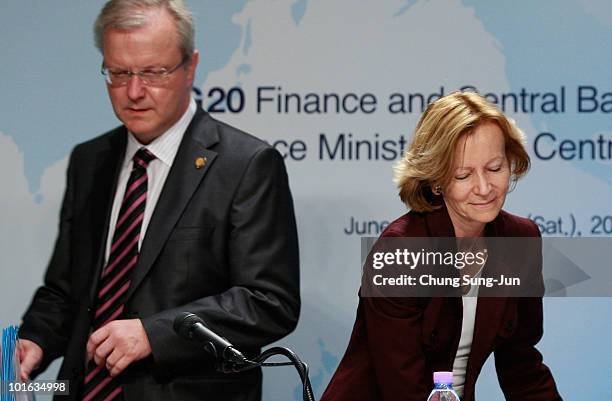 European Commissioner for Economic and Monetary Affairs Olli Rehn and EU Finance Minister Elena Salgado attend a press conference at the G-20...