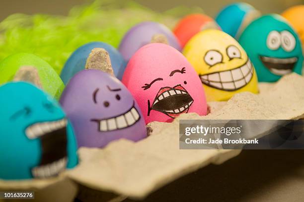 easter eggs with faces - easter and humour stockfoto's en -beelden