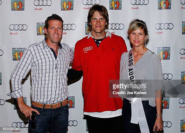 Tom Brady of New England Patriots poses for a photo with Michael Patrick VIP and Media manager, Audi of America and Anja Kaehny East Coast Media...