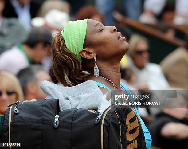 Serena Williams looks up during her women's third round match against Russia's Anastasia Pavlyuchenko in the French Open tennis championship at the...