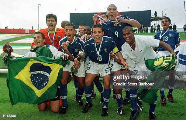 Brazil celebrate as they defeat Australia on penalties to win the FIFA Under 17 World Cup soccer final at the North Harbour Stadium, Auckland, New...