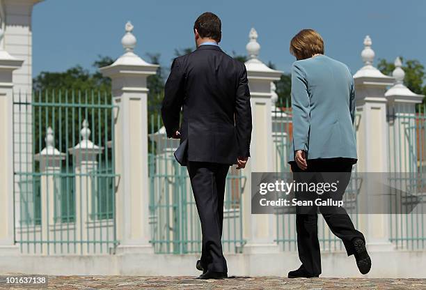 German Chancellor Angela Merkel and Russian President Dmitry Medvedev depart after speaking to the media following bilateral talks at Meseberg Palace...