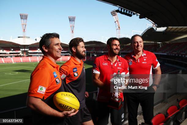 Giants coach Leon Cameron, Giants captain Callan Ward, Swans captain Josh Kennedy and Swans coach John Longmire pose during a Greater Western Sydney...