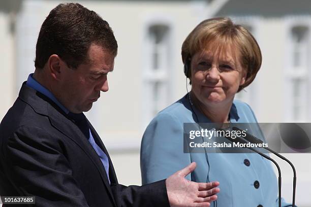 German Chancellor Angela Merkel and Russian President Dmitry Medvedev attend a press conference following bilateral talks at Meseberg Palace on June...