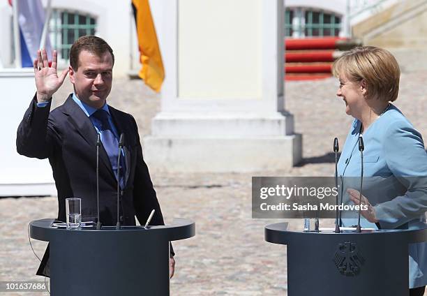 German Chancellor Angela Merkel and Russian President Dmitry Medvedev attend a press conference following bilateral talks at Meseberg Palace on June...