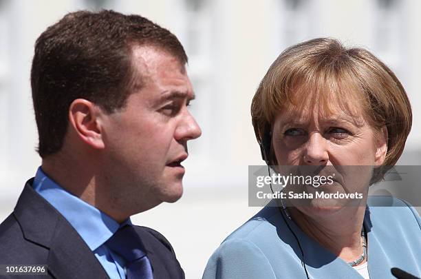 German Chancellor Angela Merkel and Russian President Dmitry Medvedev attend a press conference following bilateral talks at Meseberg Palace on June...