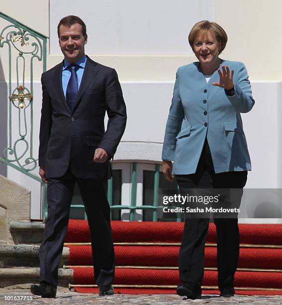 German Chancellor Angela Merkel and Russian President Dmitry Medvedev attend a press conference following bilateral talks at Meseberg Palace on June...