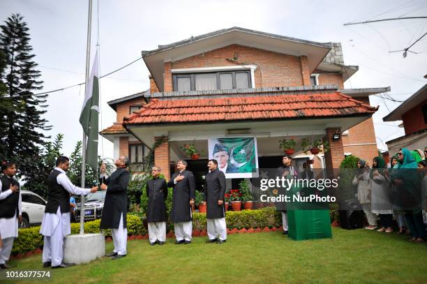 Pakistani Ambassador for Nepal Mazhar Javed hoists the Pakistani national flag during a special programme held on the eve of 71st Independence Day of...