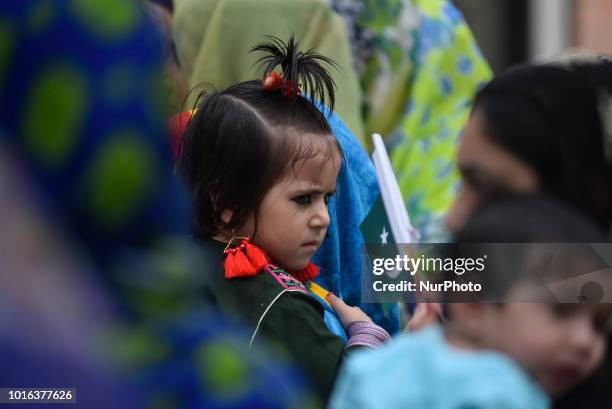 Little girl hold Pakistan Flag during a special programme held on the eve of 71st Independence Day of Pakistan, at the Embassy of Pakistan in...