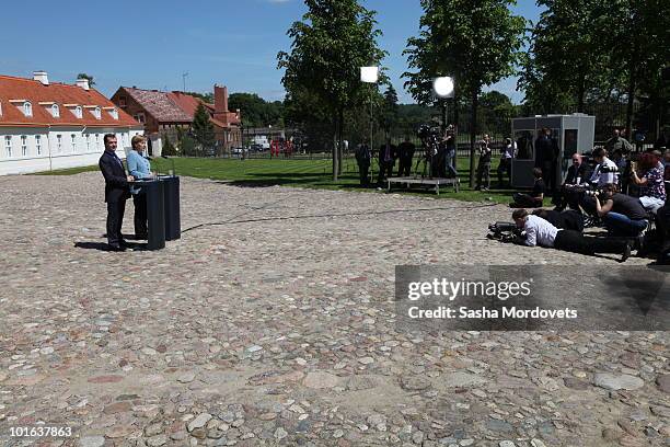 German Chancellor Angela Merkel and Russian President Dmitry Medvedev attend a press conference following bilateral talks at Meseberg Palace on June...