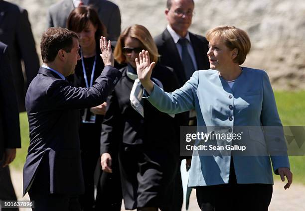 German Chancellor Angela Merkel and Russian President Dmitry Medvedev bid one another farewell after meeting at Meseberg Palace on June 5, 2010 in...