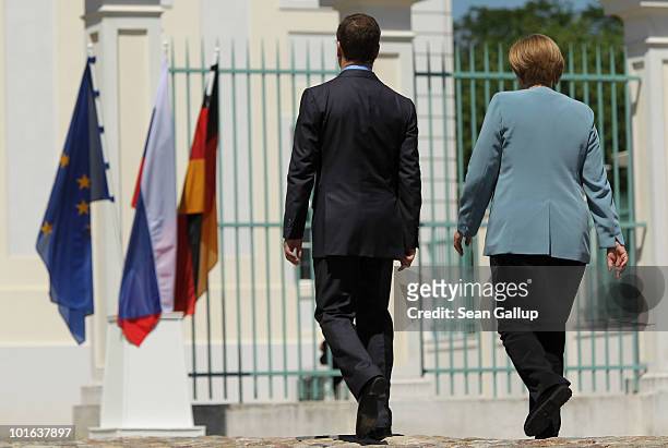 German Chancellor Angela Merkel and Russian President Dmitry Medvedev depart after speaking to the media following bilateral talks at Meseberg Palace...