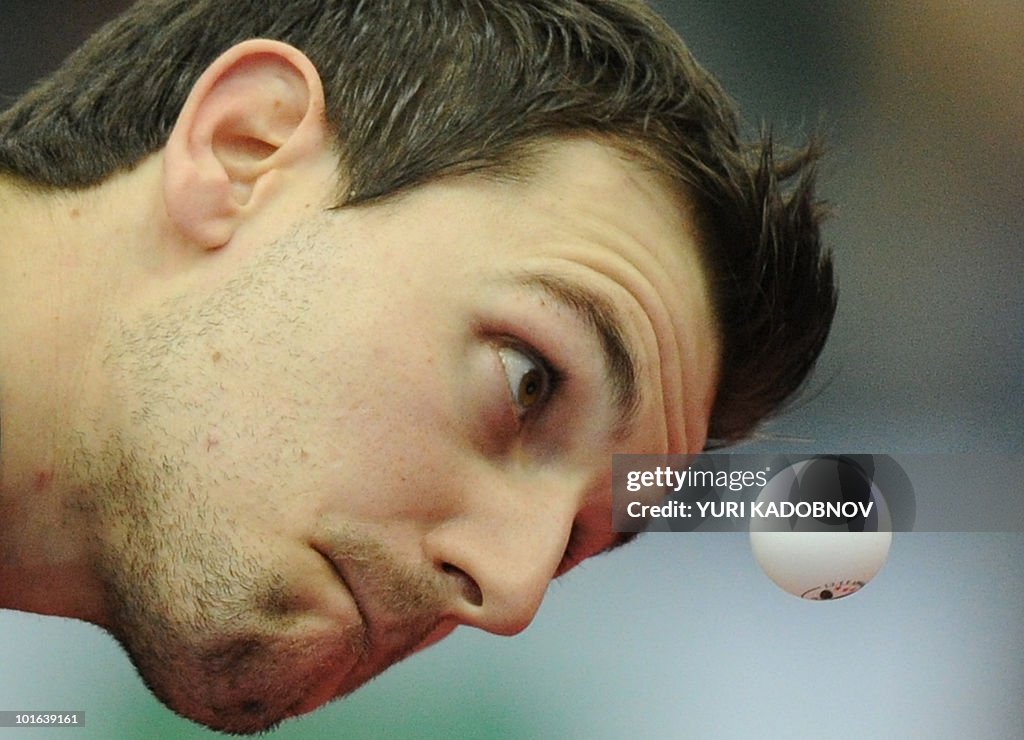 Timo Boll of Germany serves to Seung Min