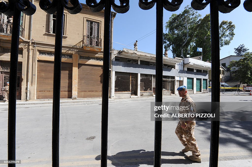 UN peacekeepers in blue berets guard the