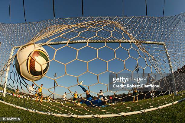 Mark Schwarzer of Australia is beaten by a shot from Herculez Gomez of the USA during the International Friendly between the Australian Socceroos and...