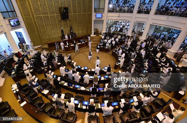 This photograph taken on August 13, 2018 show Pakistani legislators taking oath during the first session of the provincial assembly after the July 25...