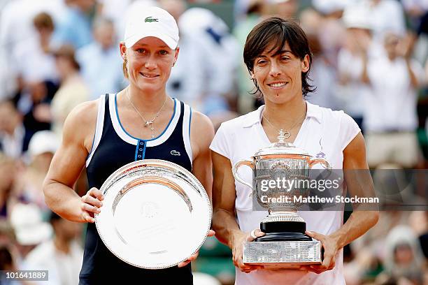 Francesca Schiavone of Italy and Samantha Stosur of Australia pose with their trophies after the women's singles final match between Francesca...