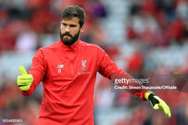 Liverpool goalkeeper Alisson Becker gives the thumbs-up ahead of the pre-season friendly match between Liverpool and Torino at Anfield on August 7,...