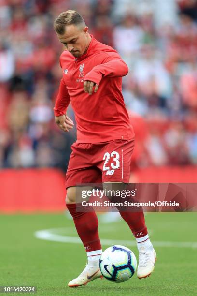 Xherdan Shaqiri of Liverpool warms up ahead of the pre-season friendly match between Liverpool and Torino at Anfield on August 7, 2018 in Liverpool,...