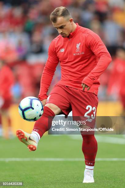 Xherdan Shaqiri of Liverpool warms up ahead of the pre-season friendly match between Liverpool and Torino at Anfield on August 7, 2018 in Liverpool,...