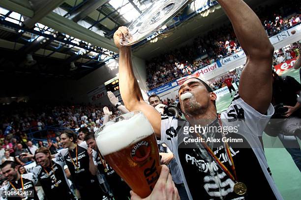 Daniel Narcisse of Kiel celebrates after the Toyota Handball Bundesliga match between TV Grosswallstadt and THW Kiel at the Frankenstolz Arena on...