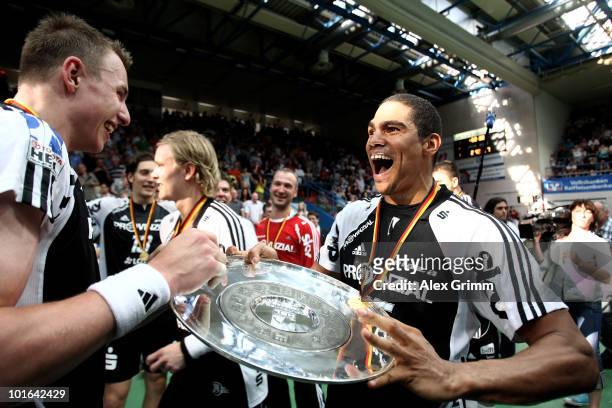 Filip Jicha and Daniel Narcisse of Kiel celebrate after the Toyota Handball Bundesliga match between TV Grosswallstadt and THW Kiel at the...