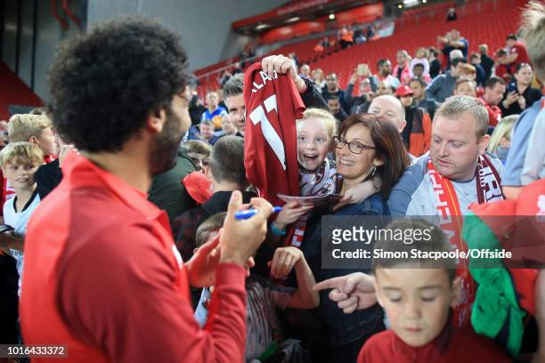 Woman and young girl react after getting an autograph from Mohamed Salah of Liverpool after the pre-season friendly match between Liverpool and...