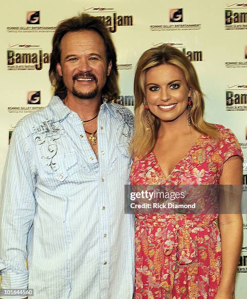 Singer/Songwriter Travis Tritt and FOX National TV Personility Courtney Friel backstage during the 2010 BamaJam Music & Arts Festival at the corner...