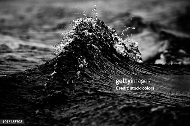 splashing wave - black and white wave stock pictures, royalty-free photos & images