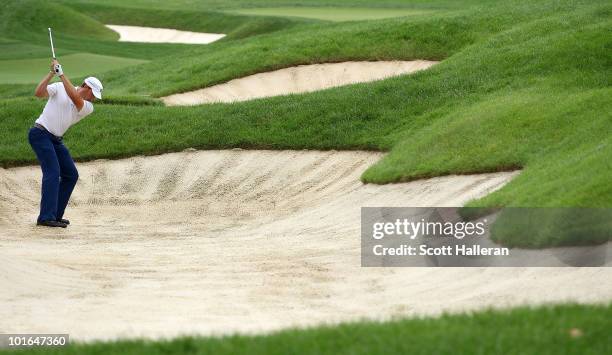 Ricky Barnes plays a bunker shot on the 18th hole during the third round of the Memorial Tournament presented by Morgan Stanley at Muirfield Village...
