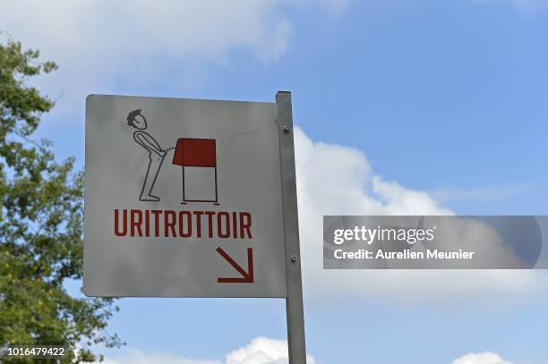 View of a local public urinal on Ile Saint Louis along the river Seine on August 14, 2018 in Paris, France. The eco-friendly Uritrottoir public...