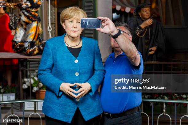 Wax figure of German Chancellor Angela Merkel during its presentation day at Panoptikum on August 14, 2018 in Hamburg, Germany. Panoptikum is...