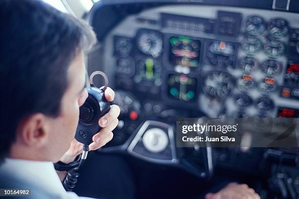 airplane pilot talking on radio - cockpit bildbanksfoton och bilder