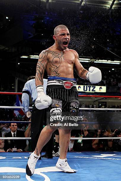 Miguel Cotto of Puerto Rico celebrates defeating Yuri Foreman during the WBA world super welterweight title fight on June 5, 2010 at Yankee Stadium...