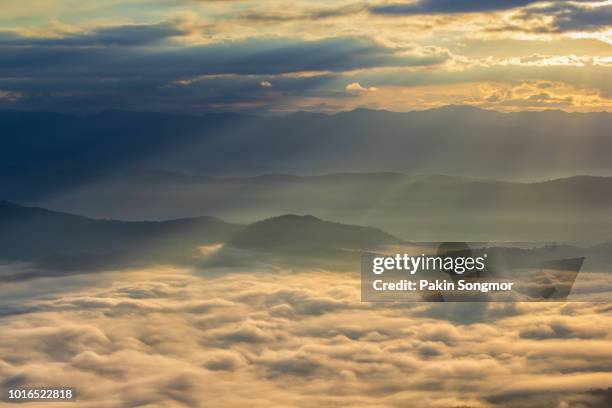 layer of mountains in the mist at doi samer dao - rolling hills sun stockfoto's en -beelden