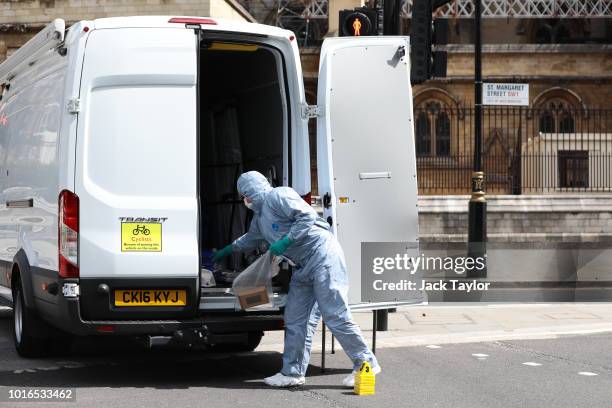 Forensic officer at the scene after a vehicle crashed into security barriers injuring a number of pedestrians early this morning outside the Houses...