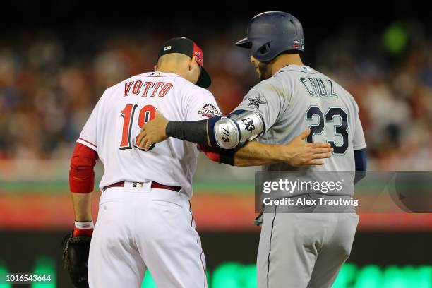 Joey Votto of the Cincinnati Reds hugs Nelson Cruz of the Seattle Mariners during the 89th MLB All-Star Game at Nationals Park on Tuesday, July 17,...