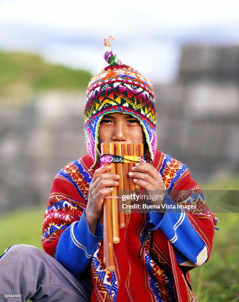 Quechua Indian Boy Playing Flute Peru High-Res Stock Photo - Getty Images