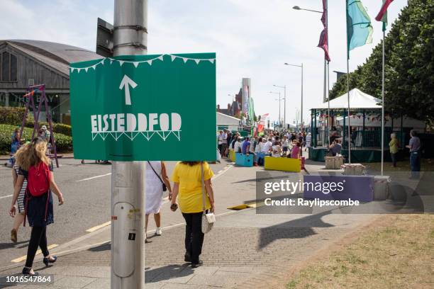 visitors arriving at the 2018 eisteddfod held in cardiff bay, cardiff. - national stock pictures, royalty-free photos & images